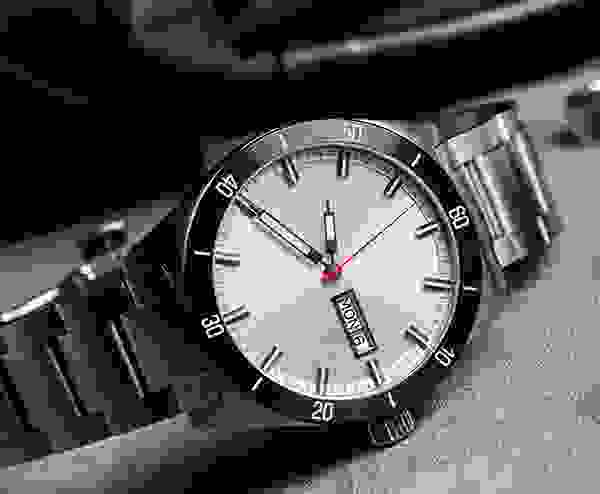 A black and white photo of a watch